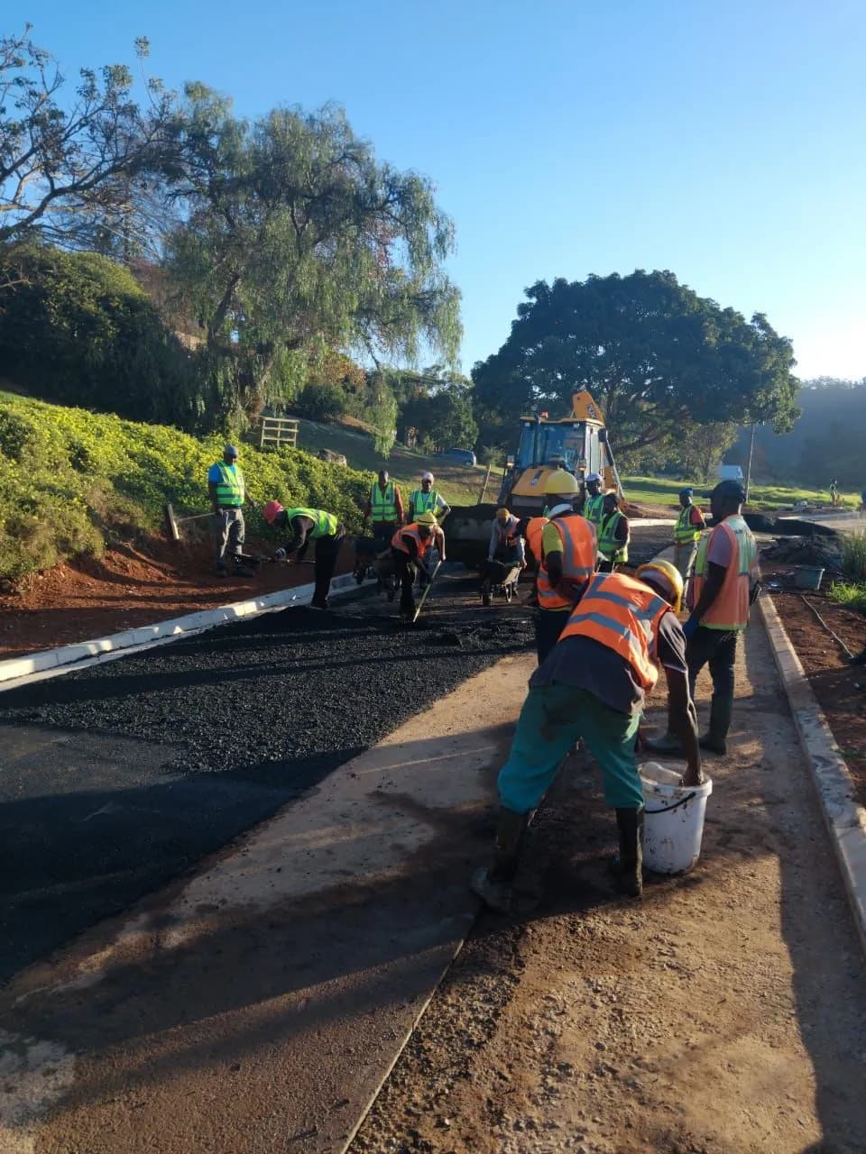 Dongo Civils crew at work on an asphalt surface